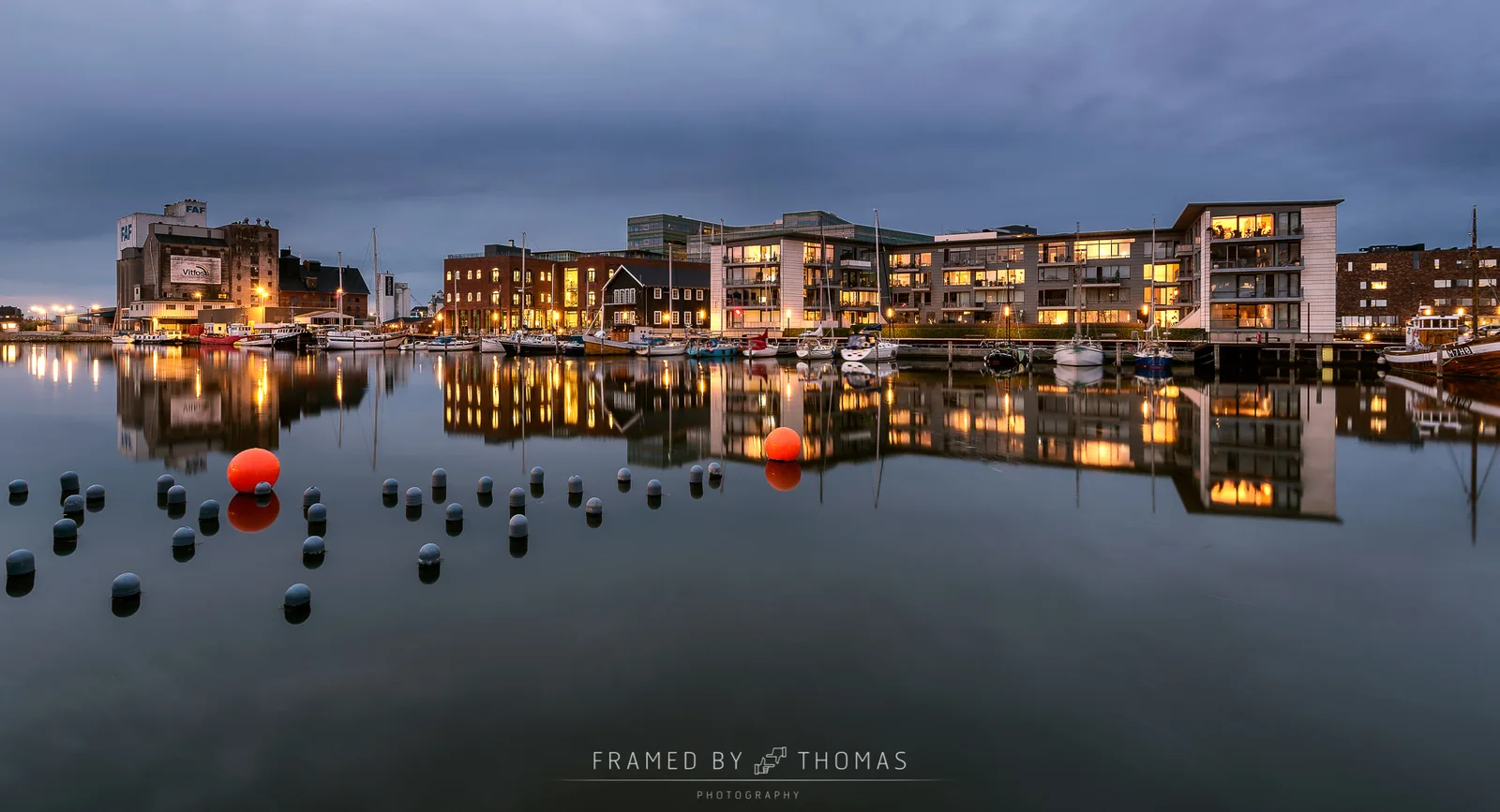 Odense harbor and waterfront at sunset, Denmark