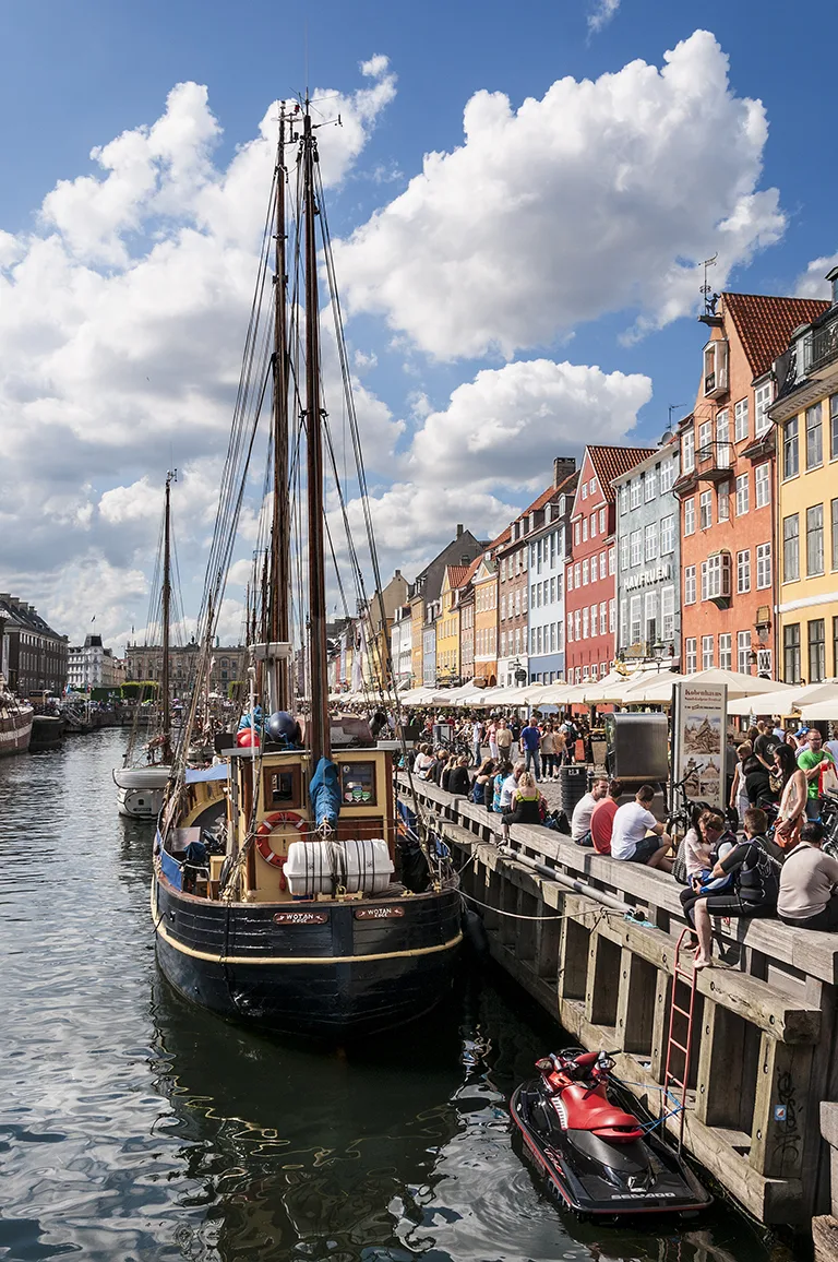 Copenhagen boat tour and harbor area from a water perspective showing boats and canal scenery