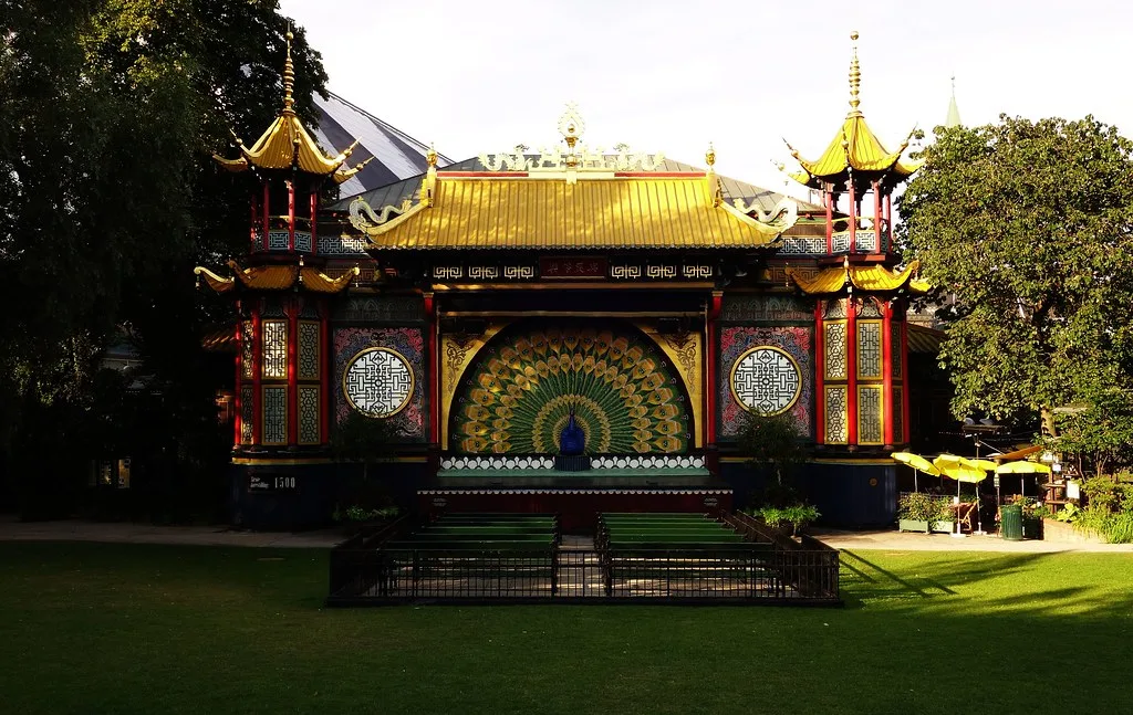 Tivoli Gardens illuminated at night with carousel lights