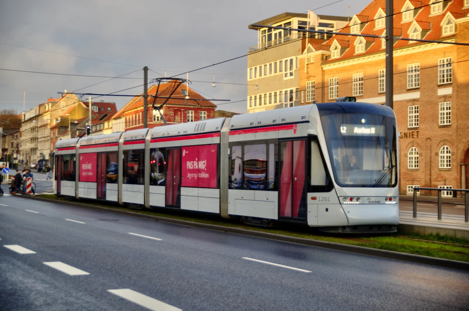Airport express bus departing from Aarhus with passengers boarding