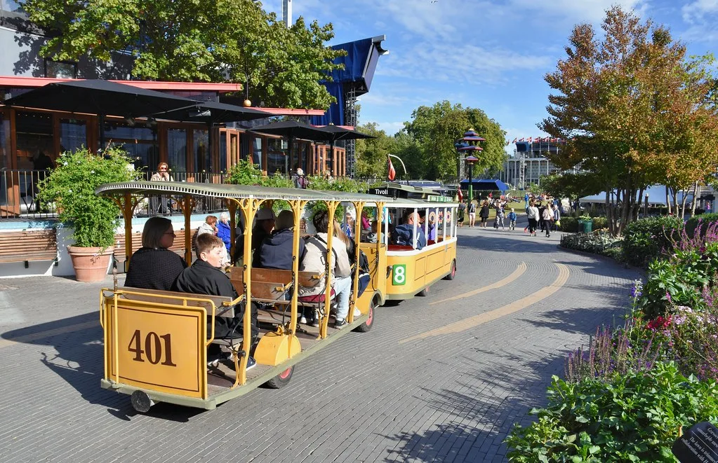 Tivoli Gardens summer season with colorful gardens and blue sky in Copenhagen