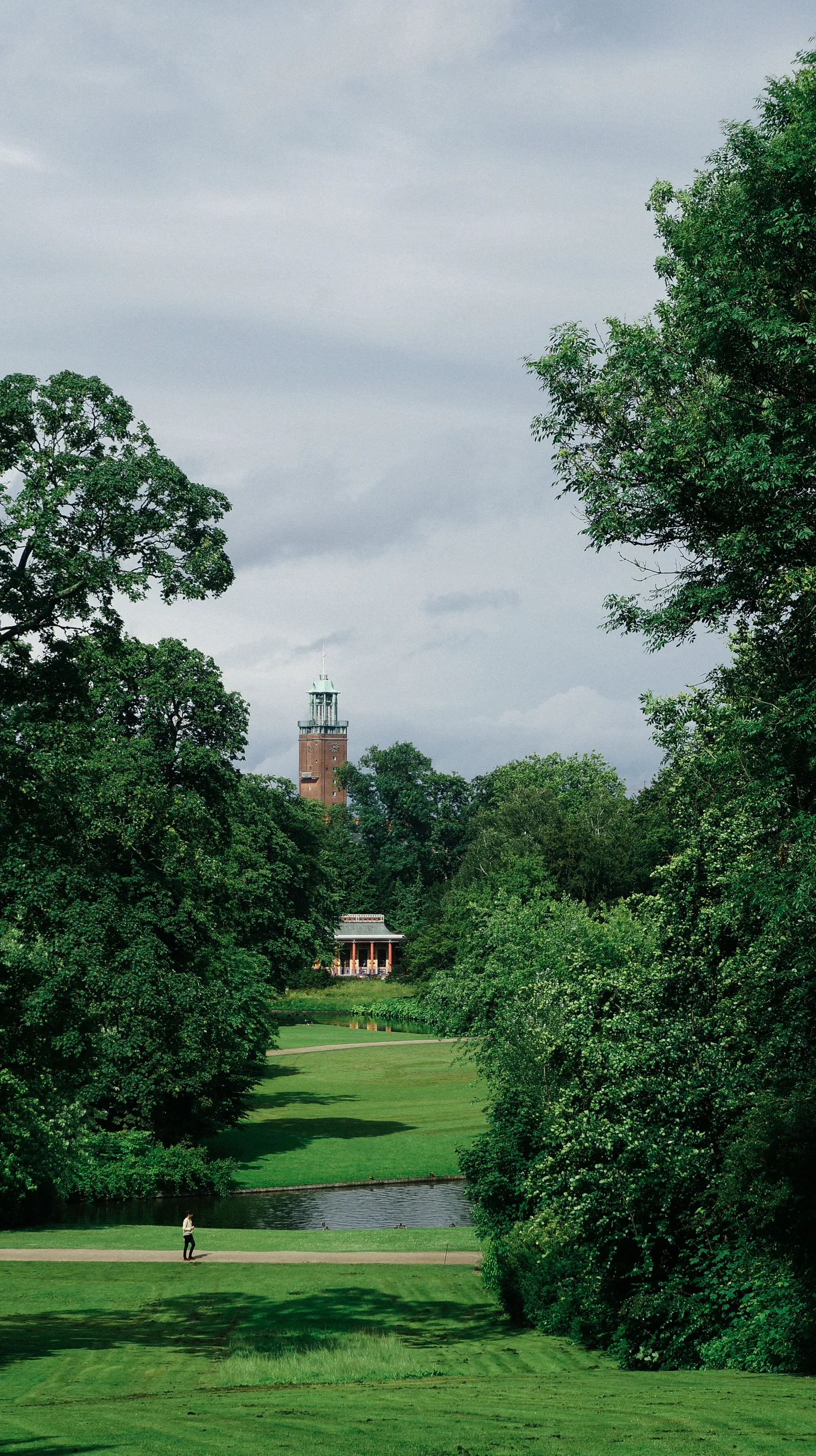 Frederiksberg Gardens with lush green spaces and tree-lined paths in Copenhagen, Denmark